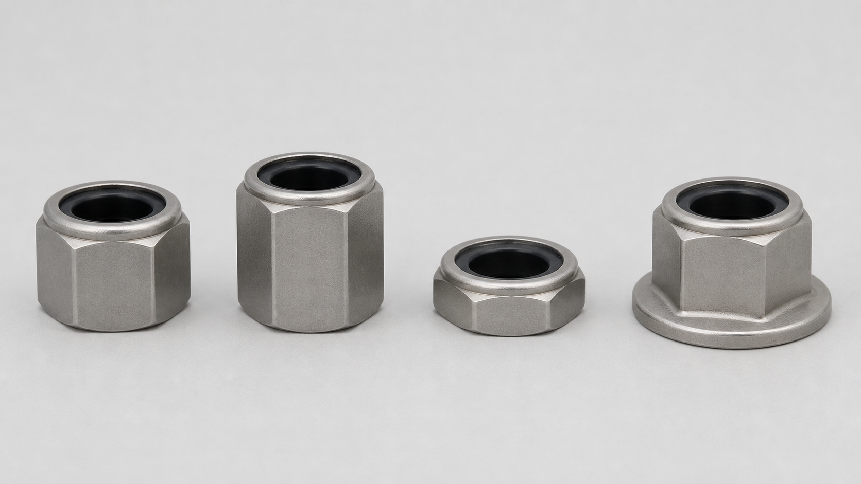 Four non-metallic-insert prevailing-torque hexagon nuts shown side by side on a light-grey background: regular, high, thin and flanged forms, with visible differences in body height and flange geometry.